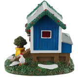 This is a different angle of this table accent. There's a chicken standing in the grass.
