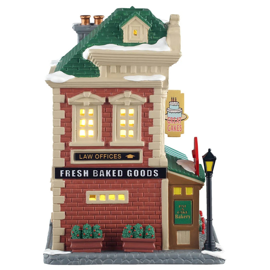 This is the other side of the building. There's a sign pointing upwards that reads "LAW OFFICES" and another sign that reads "FRESH BAKED GOODS."