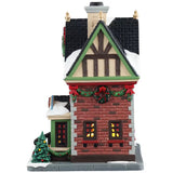 This is the other side of the building. There's snow on the roof and on the sidewalk. There's decorated garland hanging on the wall and around the windows. 