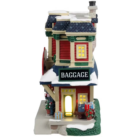 This is the side of the building. There's a big sign that reads "BAGGAGE" and a bunch of suitcases and bags underneath on the sidewalk.