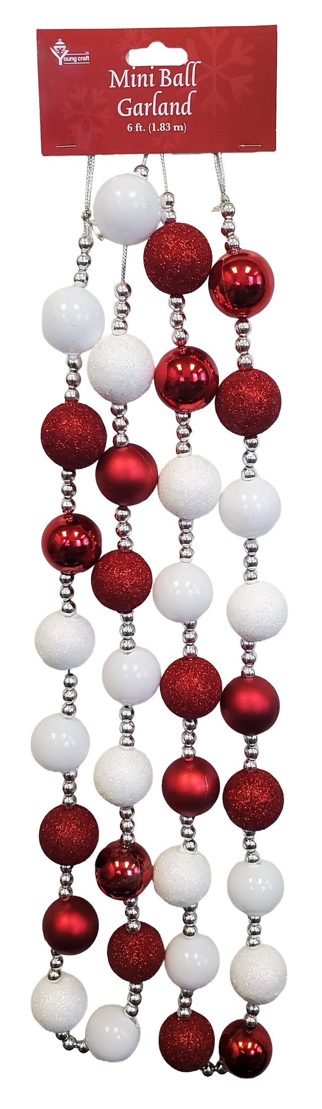This image shows the mini ball garland on a white background. The garland consists of medium sized beads in red and white, interspersed with small silver beads. The medium sized beads are matte white, white glitter, matte red, shiny red and red glitter.