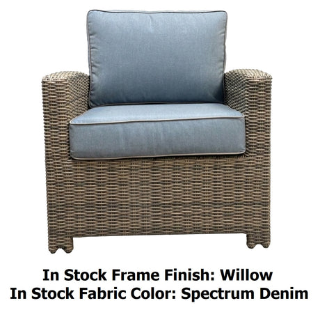 This image shows what the club chair looks like on a white background. The image reads "In Stock Frame Finish: Willow. In Stock Fabric Color: Spectrum Denim."