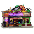 This is a Lemax Spooky Town building designed to look like a slightly rundown video rental store called Nightmares Video. There are signs that read "Closing Down Sale," "Everything Must Go," "Electronics Blow Out," "Prices Slashed! VHS = $1, DVD = $2" and "Snack Bar Inside! Please rewind or die!"