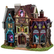 This is a Lemax Spooky Town lighted building that's designed to look like a slightly dilapidated and very colorful mansion. Some of the accents include: skulls, jack-o-lanterns, owl statues and dead plants. There are ghosts, monsters and skeletons visible in the windows. 