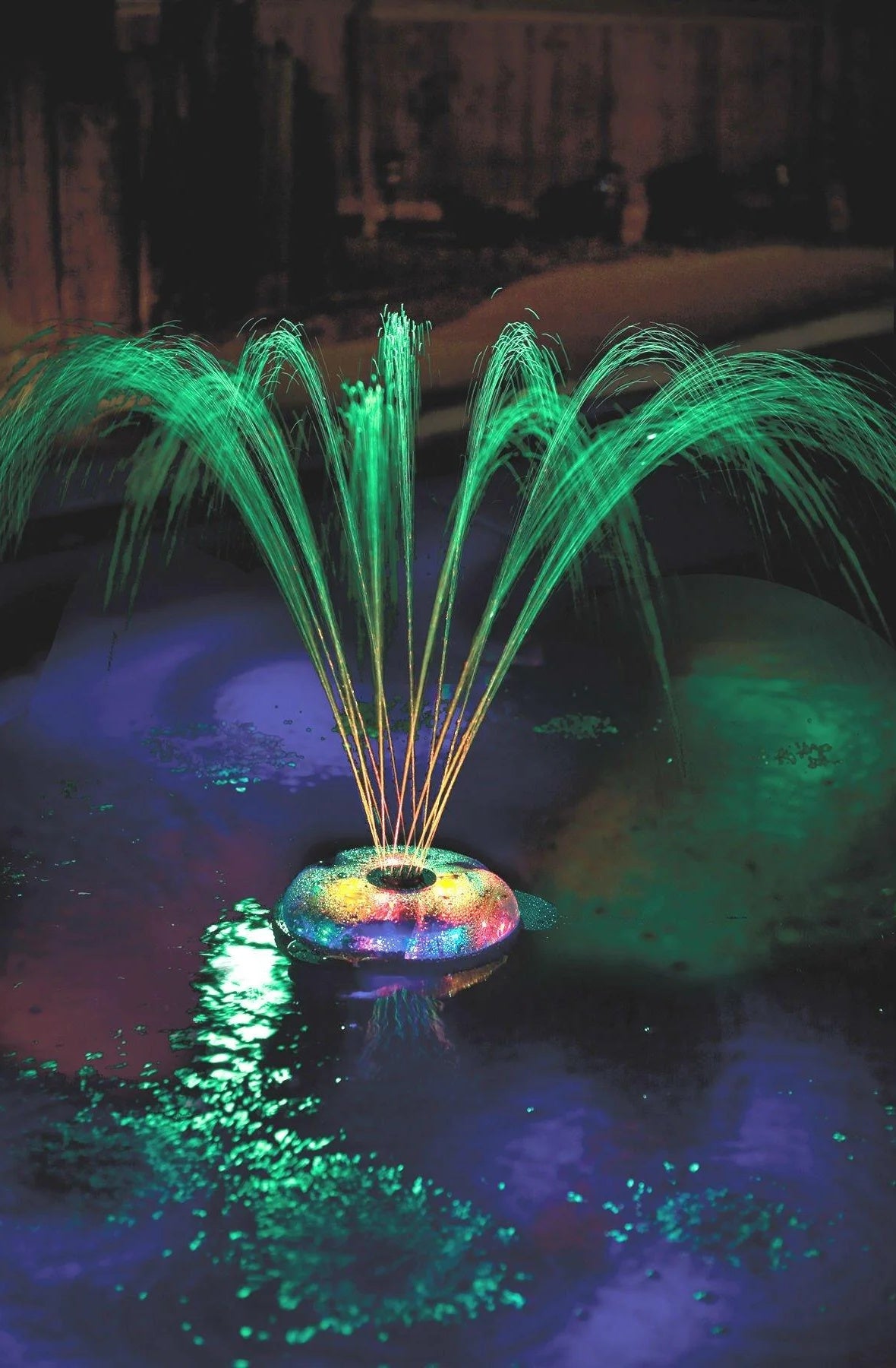 This is a lifestyle image showing the fountain and it's different lights.