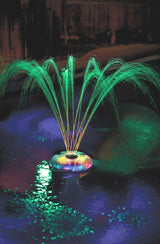 This is a lifestyle image showing the fountain and it's different lights.