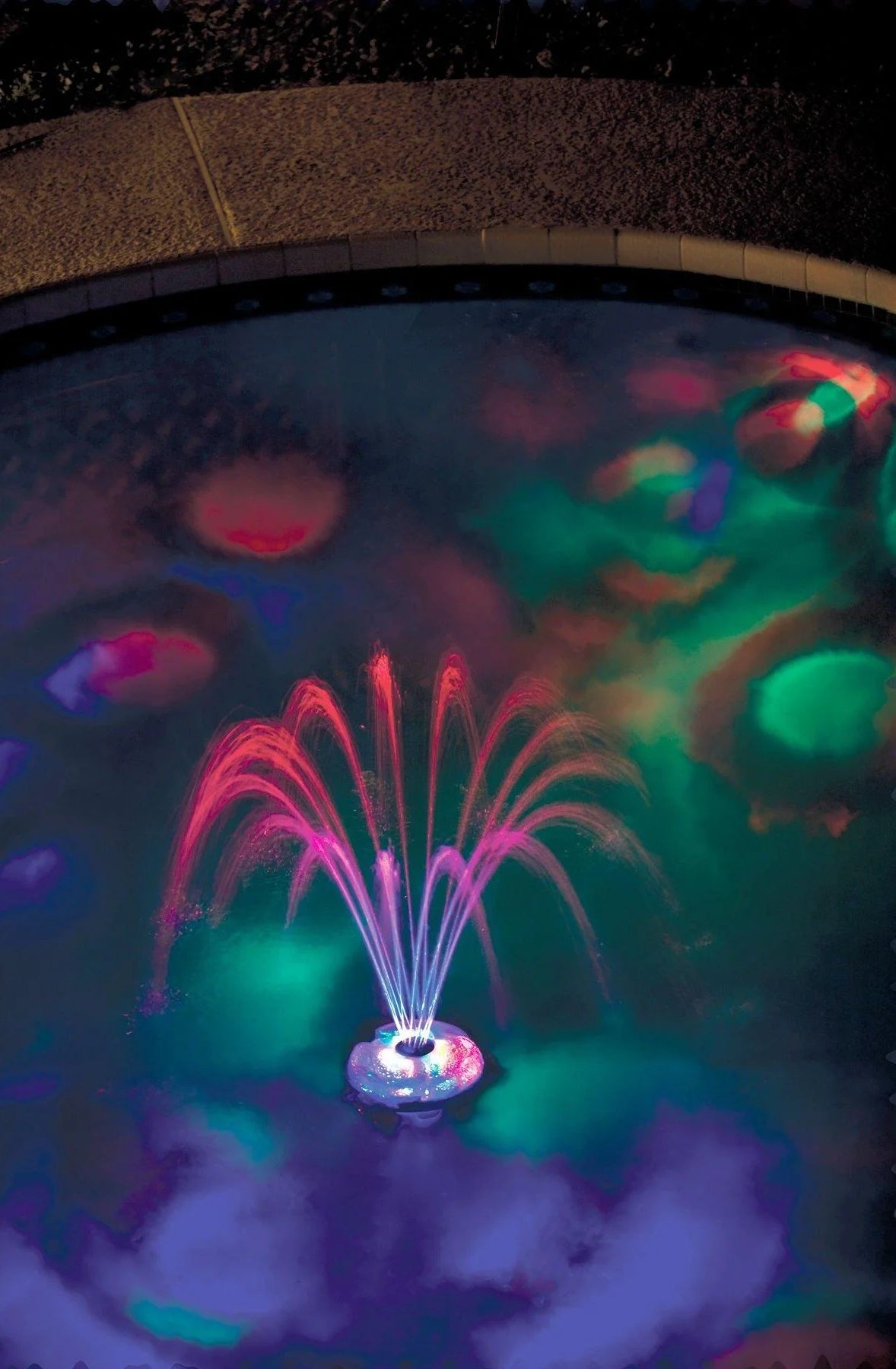 This is a lifestyle image showing the fountain and it's different lights.