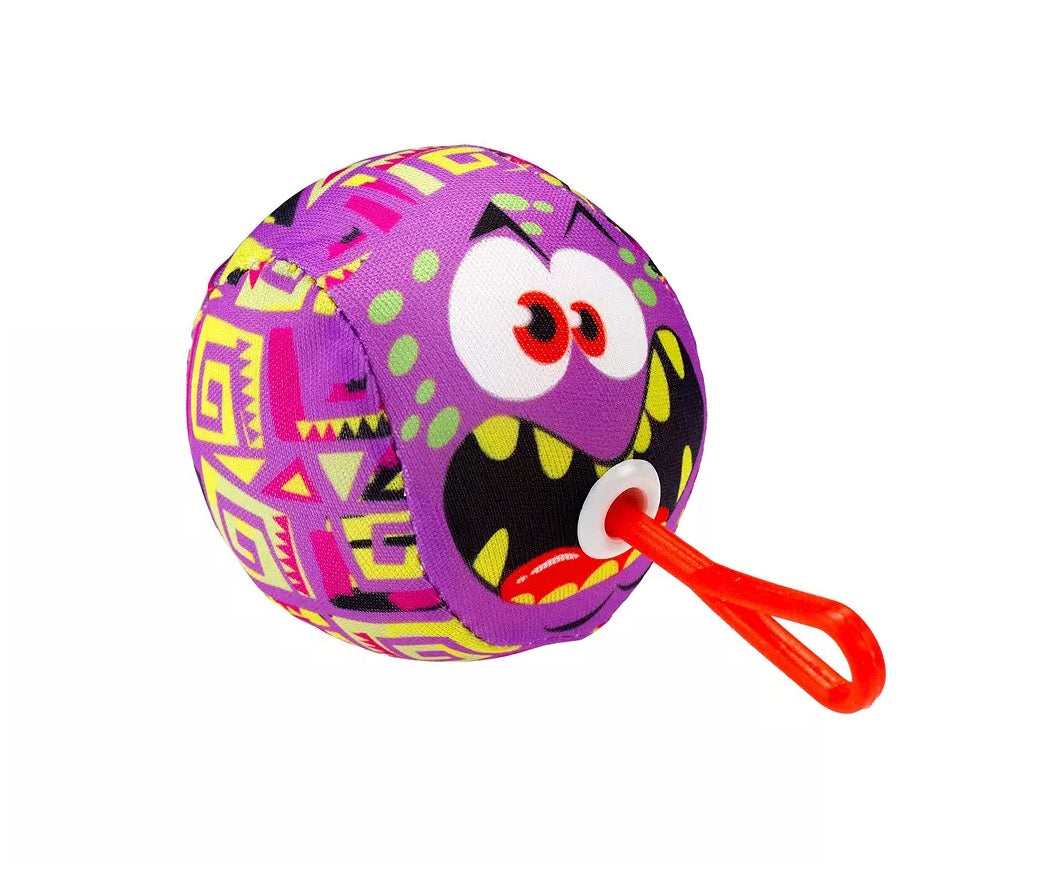 The Water Bomb Balls are shaped like multi-colored monsters with silly faces. This one is pink with green, yellow, green and black splotches. The plastic cord is red.