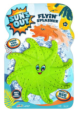 This image shows the green color option for this flyin' splasher pool toy. The packaging reads "Sun's Out Flyin' Splasher. Soak and toss! Make a big splash! Soft and squishy." This green option features a face in the middle. It has two large, blue eyes and a smile big enough to see the red tongue.