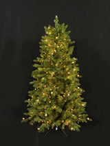 This image shows this specific artificial tree pre-lit with Warm White Starry Lights. This tree is up against a black background.