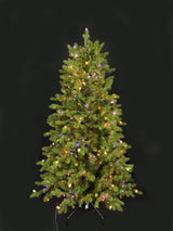 This image shows this specific artificial tree pre-lit with Multi-Colored Starry Lights. This tree is up against a black background.
