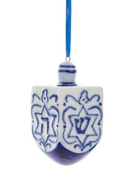This ornament is shaped like a blue and white dreidel. 