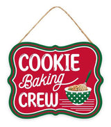 This sign is red and has a red, green and white border. It reads "COOKIE BAKING CREW" and features a bowl with cookie dough in it.
