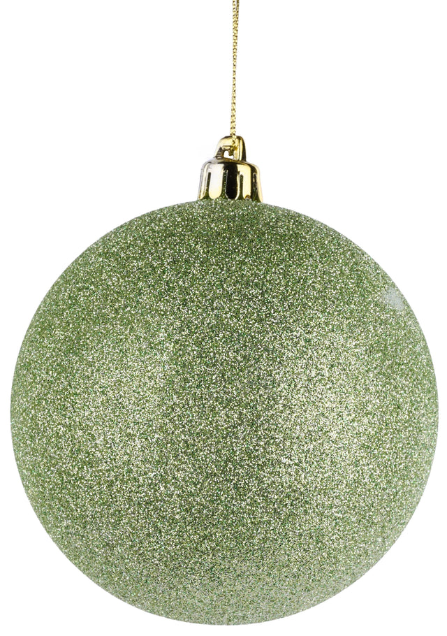 Round, ball ornament covered in sage green glitter. Hangs from a gold string.
