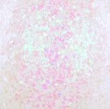 This is an up close view of the iridescent confetti glitter. It appears white and pink.