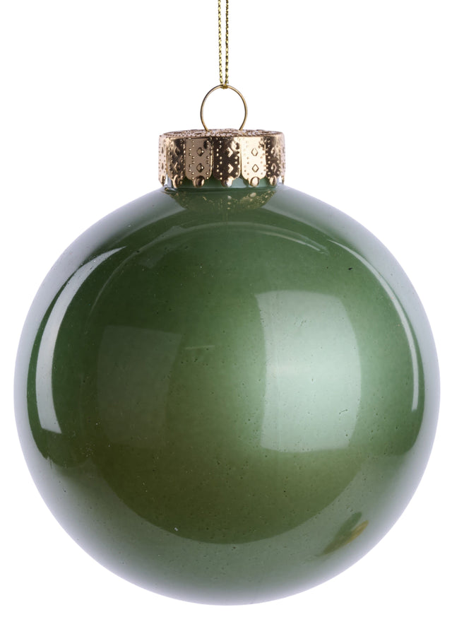 This image shows a plastic sage green ornament that was designed to look like it's made of glass. It has a glass cake top and hangs from a gold string.