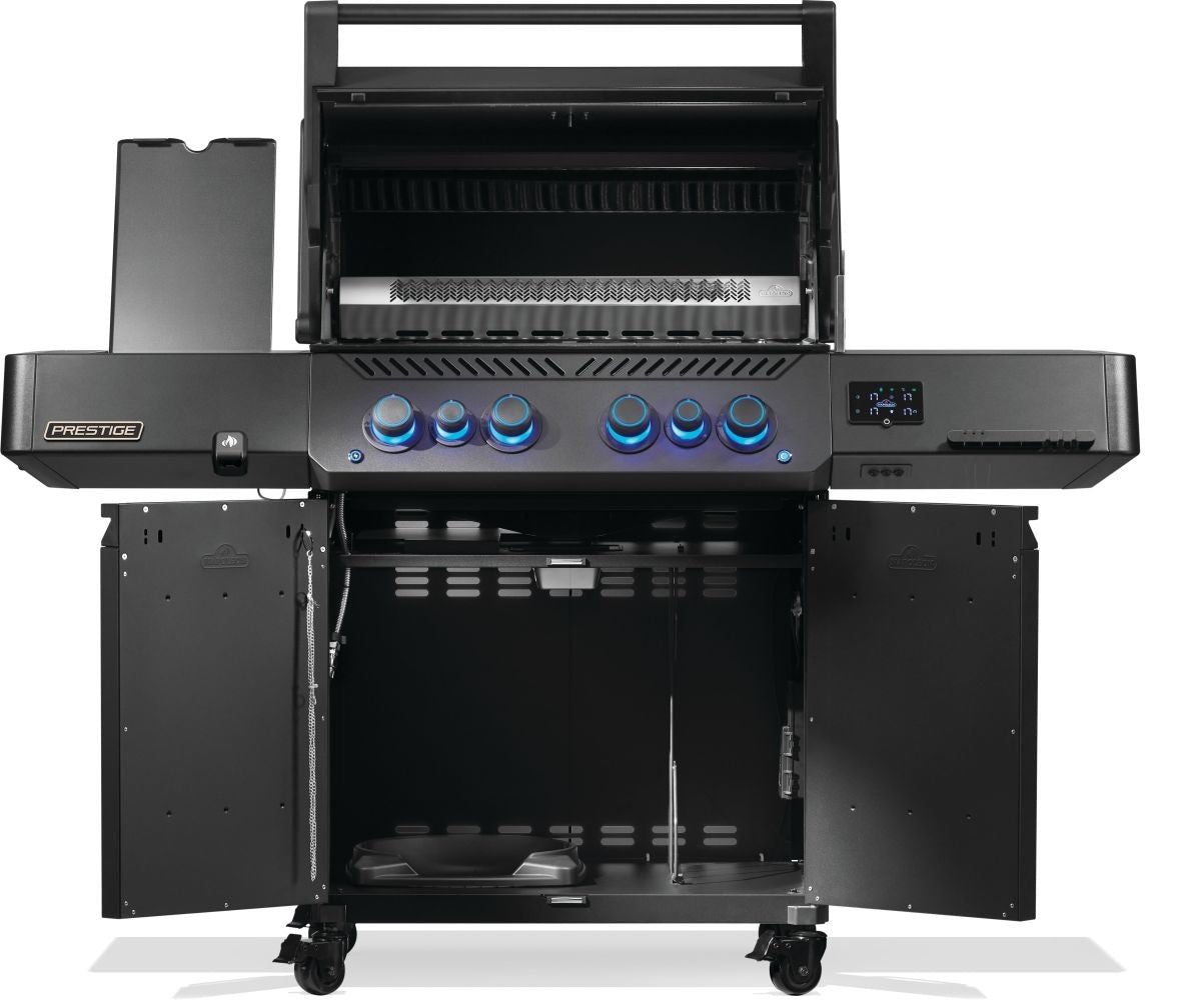 Black Napoleon grill. There is a built-in thermometer on the lid, there are two shelves outstretched, six buttons and a cabinet that opens up underneath. This is the view of everything open.
