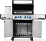 Silver and gray Napoleon grill. There is a built-in thermometer on the lid, there are two shelves outstretched, six buttons and a cabinet that opens up underneath. This is the view of everything open.