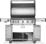 Silver and gray Napoleon grill. There is a built-in thermometer on the lid, there are two shelves outstretched, six buttons and a cabinet that opens up underneath. This is the view of everything open.