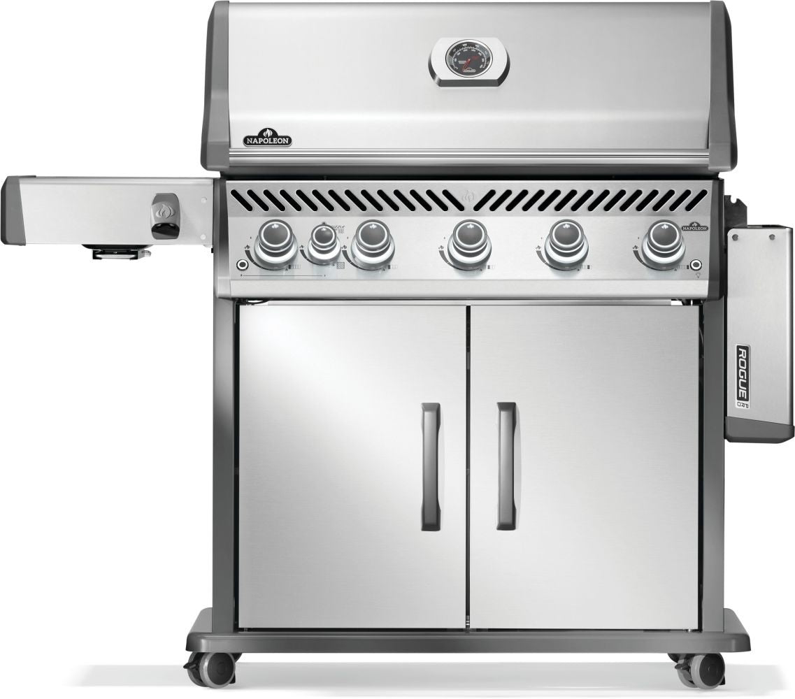 Silver and gray Napoleon grill. There is a built-in thermometer on the lid, there are two shelves outstretched, six buttons and a cabinet that opens up underneath. This is the front view with one shelf down.