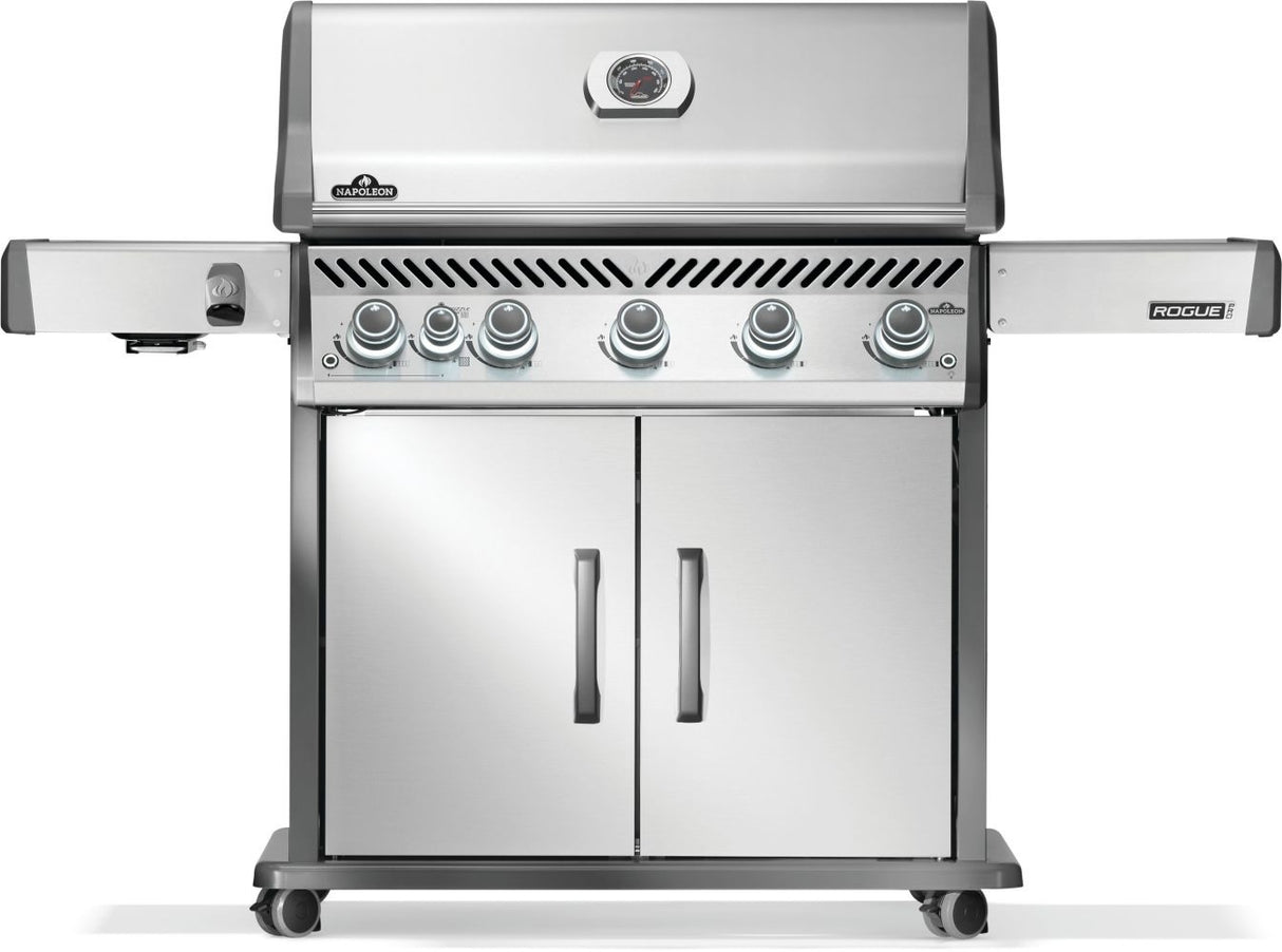 Silver and gray Napoleon grill. There is a built-in thermometer on the lid, there are two shelves outstretched, six buttons and a cabinet that opens up underneath. This is the front view.
