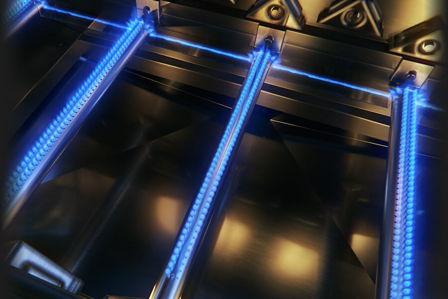 Cross lighting burner. If a burner goes out or fails to light, cross-lighting brackets automatically ignite the adjacent burners.