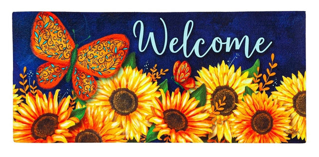 Blue welcome mat that features a butterfly that is orange, red, green and light blue. There are also bright sunflowers and leaves.
