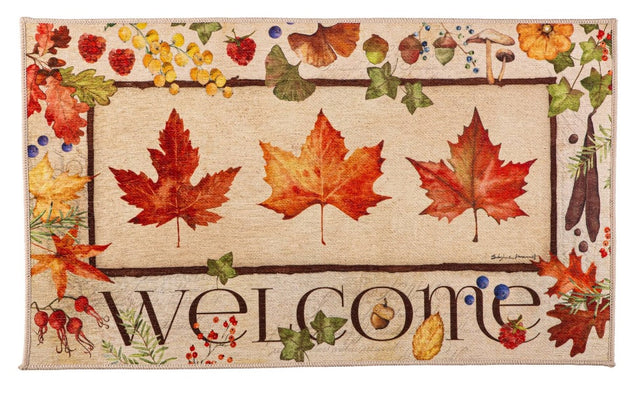 Washable mat that features a "Welcome" message surrounded by fall leaves in an autumn color palette of reds, greens and yellows.