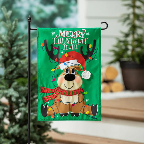 Green flag that reads "Merry Christmas to all" and features a cute, cartoon reindeer. The reindeer is wearing a red and green striped scarf, a Santa hat and there's a string of multi-colored lights wrapped around him.