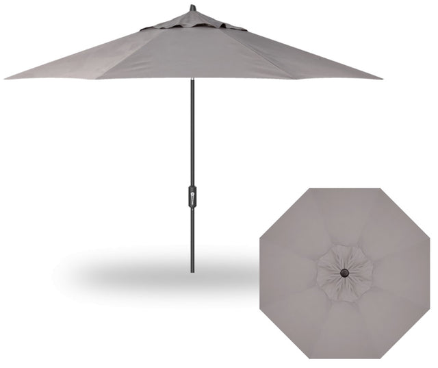 A tan colored market umbrella with a black pole.