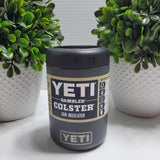 Charcoal colored Yeti colster on a table between two succulents.