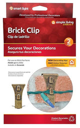 This image shows the packaging that these brick clips come in. It reads "Brick Clip. Secures your decorations. For use on brick surfaces. Holds up to 25 lbs. Installs in seconds. New decorating app. Free online tutorials."