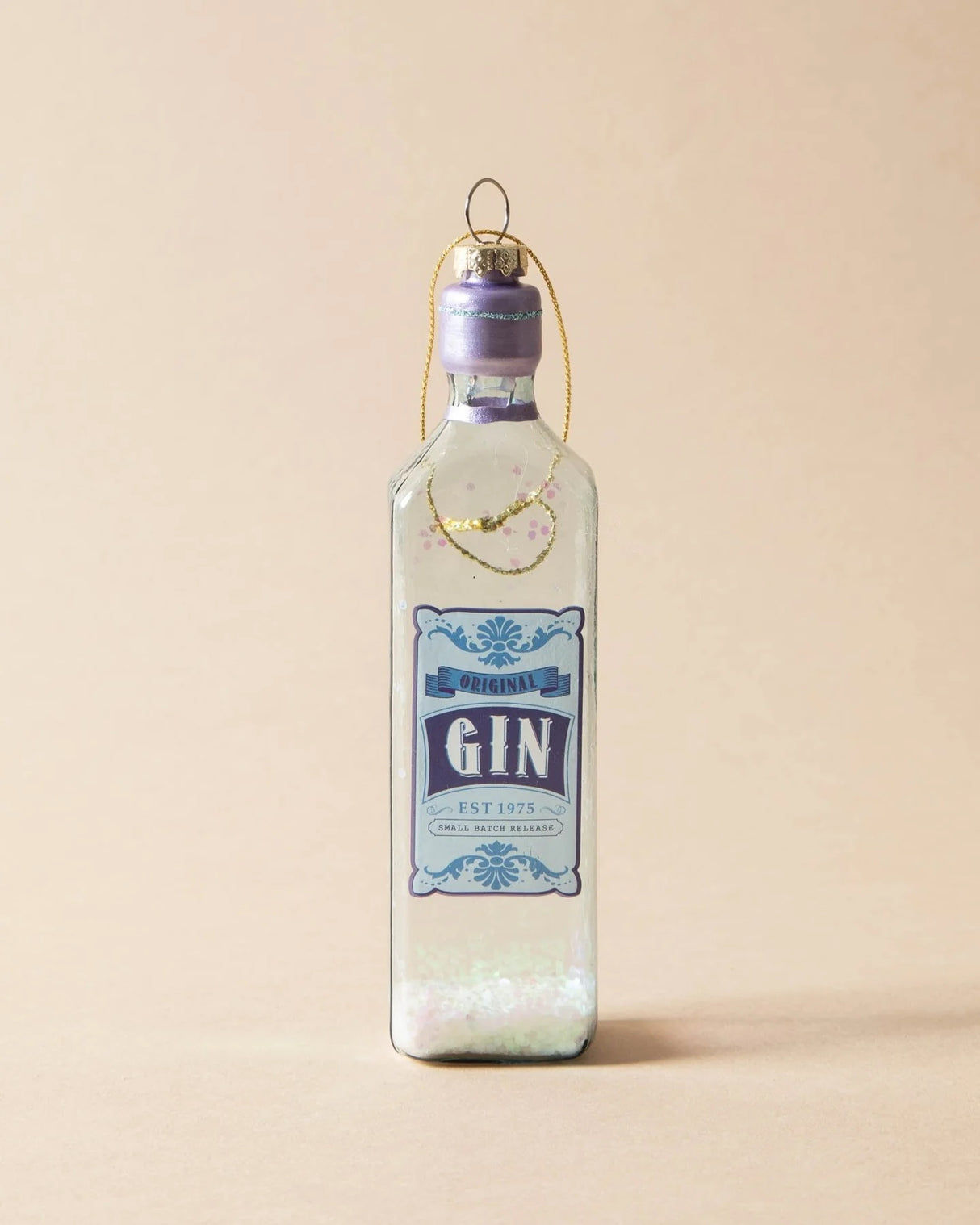 Ornament shaped like a miniature bottle of alcohol. One ornament is red and reads "Aged Brandy." One ornament is yellow and reads "Whiskey." One ornament is orange and reads "Scotch." One ornament is yellow and reads "Bourbon." One ornament is light blue and reads "Gin." Each ornament has glitter inside.