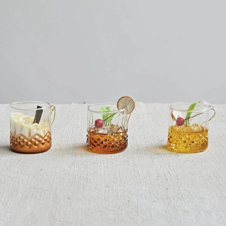 Cocktail shaped ornament. Crafted in the shape of a low ball whiskey glass. One ornament is a tequila sunrise. One ornament is a mudslide. One ornament is an old-fashioned.