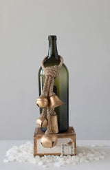 This is a lifestyle image showing the bells wrapped around a wine bottle.