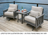 Two resin swivel chairs with an end table on a balcony over a body of water