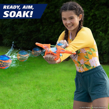 Dunk a Storm Ball in water until filled, place your ball in the rocket, pull back the band and launch at the competition!