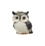 Fluffy ornament shaped like an owl. One is tan, one is brown and one is grey.