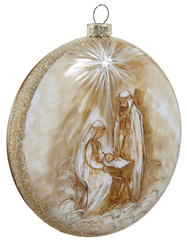 Round disc ornament that features a painted version of the Holy Family in the Nativity Scene with the North Star in the background. The border is covered in gold glitter.