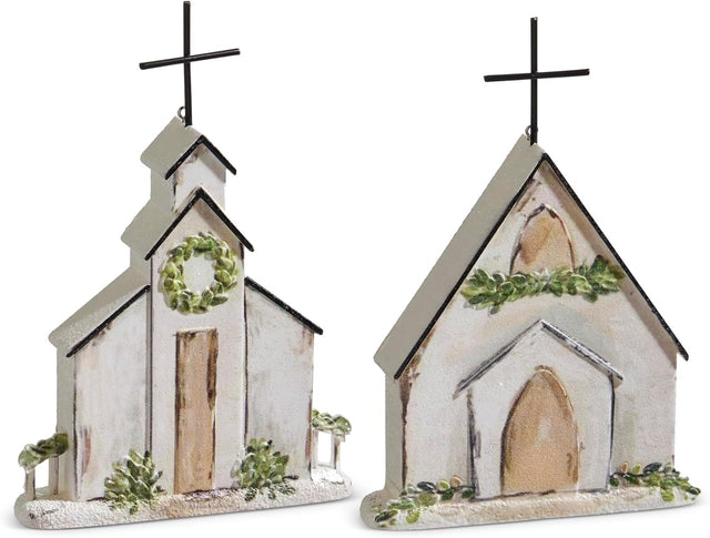 Ornament shaped like a church. One church features a wreath near the steeple. One church features a garland near the steeple.