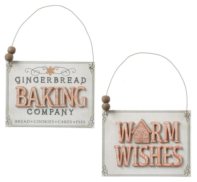 Ornament shaped like a holiday sign. One sign reads "Warm Wishes." One sign reads "Gingerbread Baking Company. Bread, Cookies, Cakes, Pies." Each sign has a dainty border and small wooden beads on the wire holder.