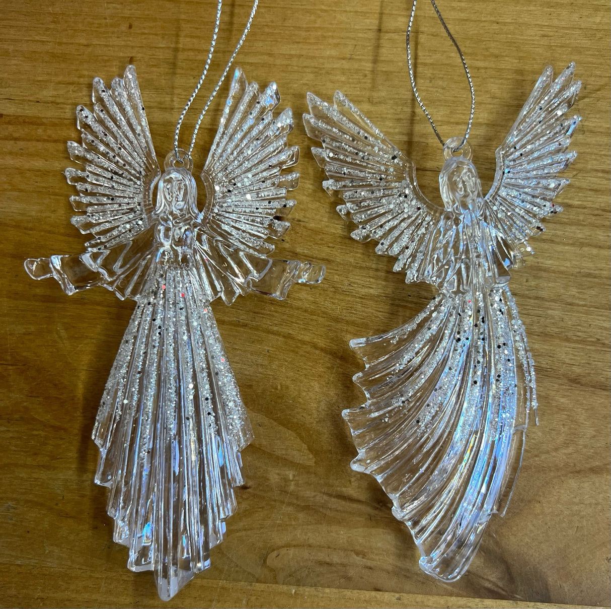 Glittered plastic ornaments shaped like an angel.