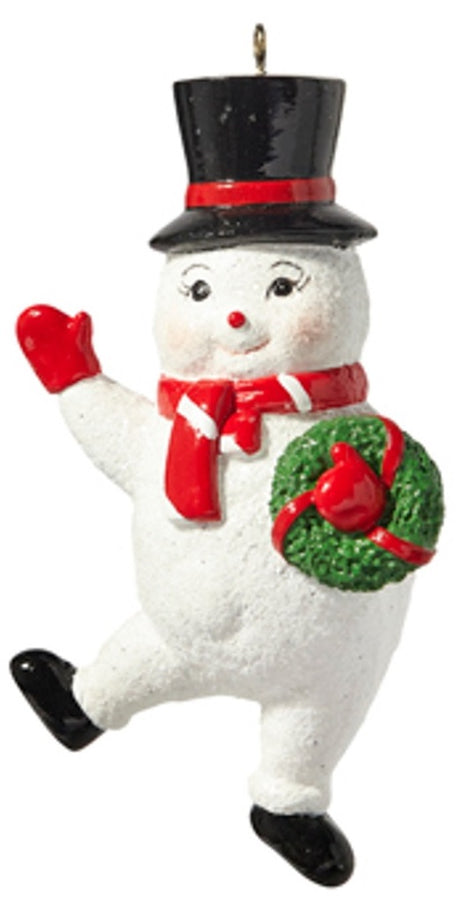 Ornament shaped like a smiling snowman wearing a black top hat. One snowman is waving and holding a wreath. One snowman has his eyes closed and is holding a candy cane.