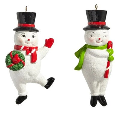 Ornament shaped like a smiling snowman wearing a black top hat. One snowman is waving and holding a wreath. One snowman has his eyes closed and is holding a candy cane.