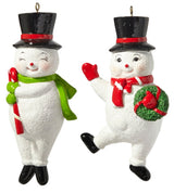 Ornament shaped like a smiling snowman wearing a black top hat. One snowman is waving and holding a wreath. One snowman has his eyes closed and is holding a candy cane.