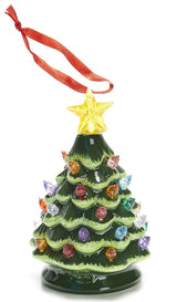 Light up Christmas decoration. Ornament shaped like a decorated tree with a star on top. Lights on the tree are multi-colored.