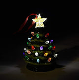 Light up Christmas decoration. Ornament shaped like a decorated tree with a star on top. Lights on the tree are multi-colored.