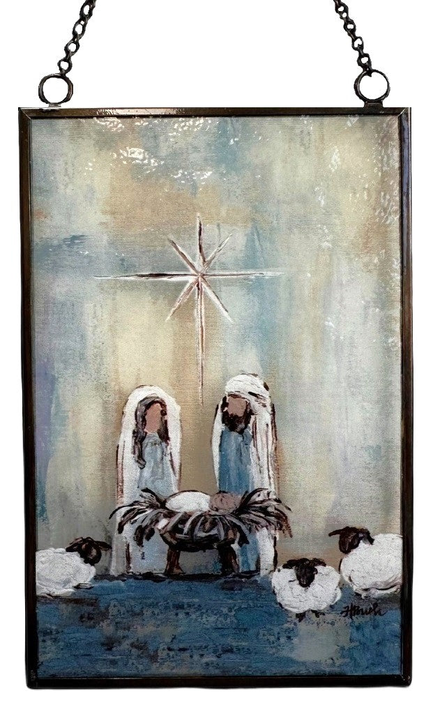 Christmas ornament with a painted Nativity Scene on it. Designed to look like stained glass.