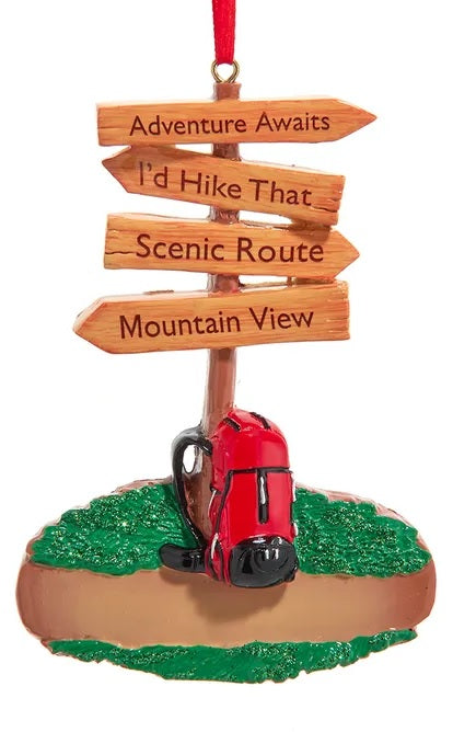 Christmas ornament shaped like a hiking trail sign. Signs read "Adventure Awaits," "I'd Hike That," Scenic Route" and "Mountain View."