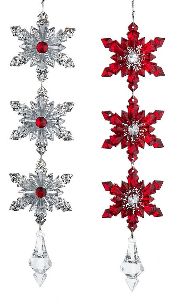 Dangling snowflake ornaments that end in a gem. One ornament features three silver snowflakes with red accents. One ornament features three red snowflakes with silver accents.